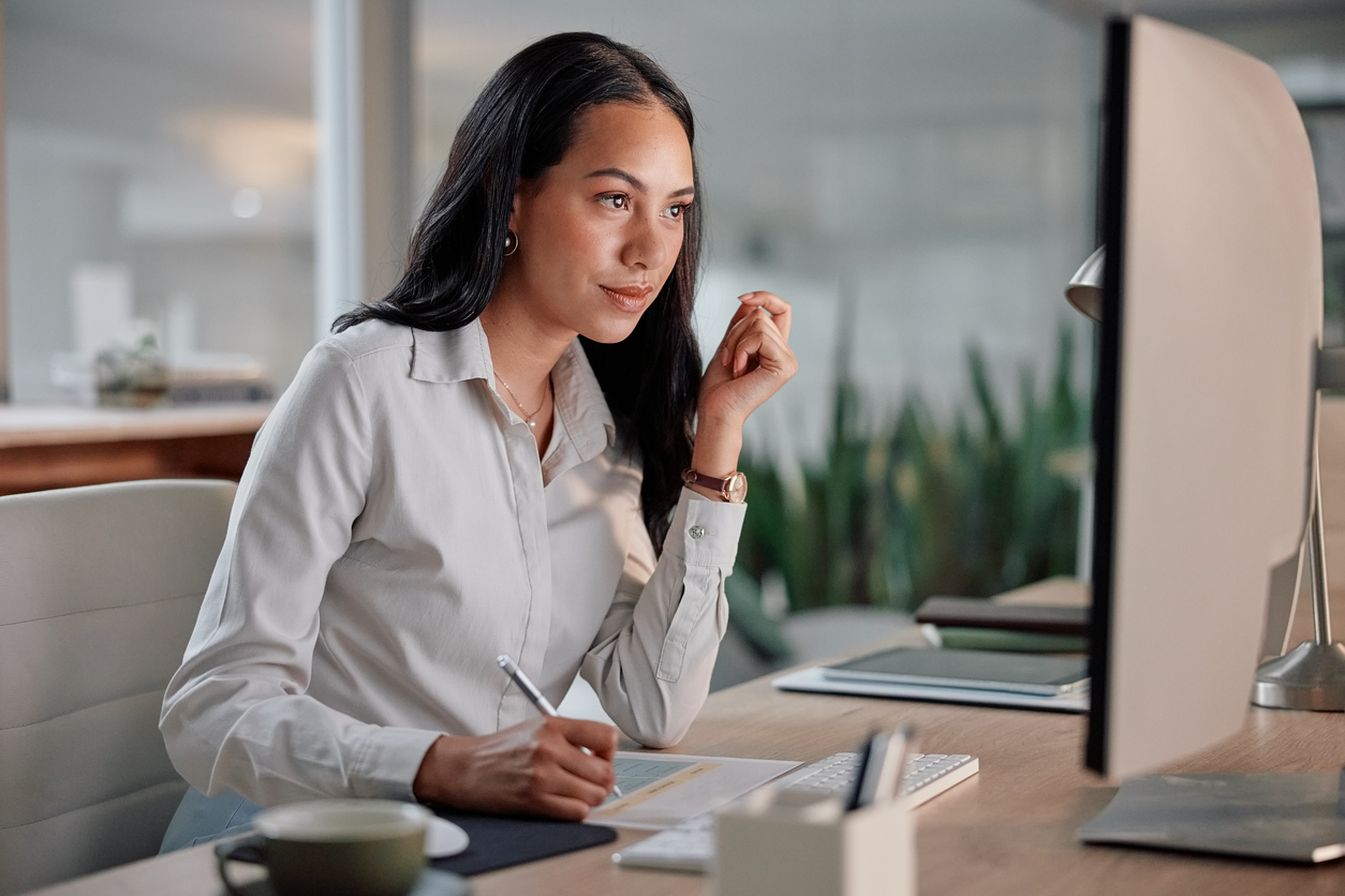 A Tax Examiner Working on a Monitor..jpg