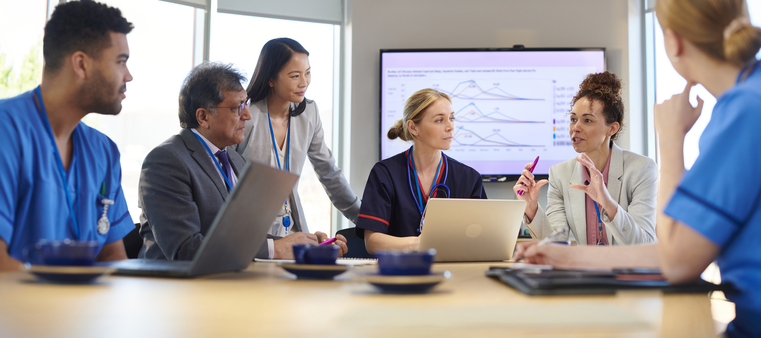 Health Care Executives Meeting Around a Conference Table