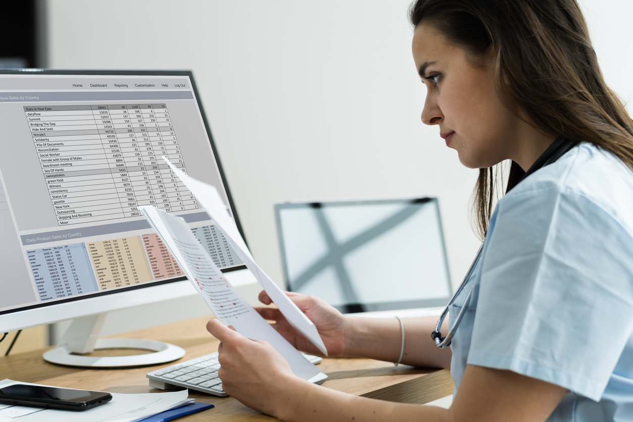 Health Care Worker Looking at Health Care Data on a Computer