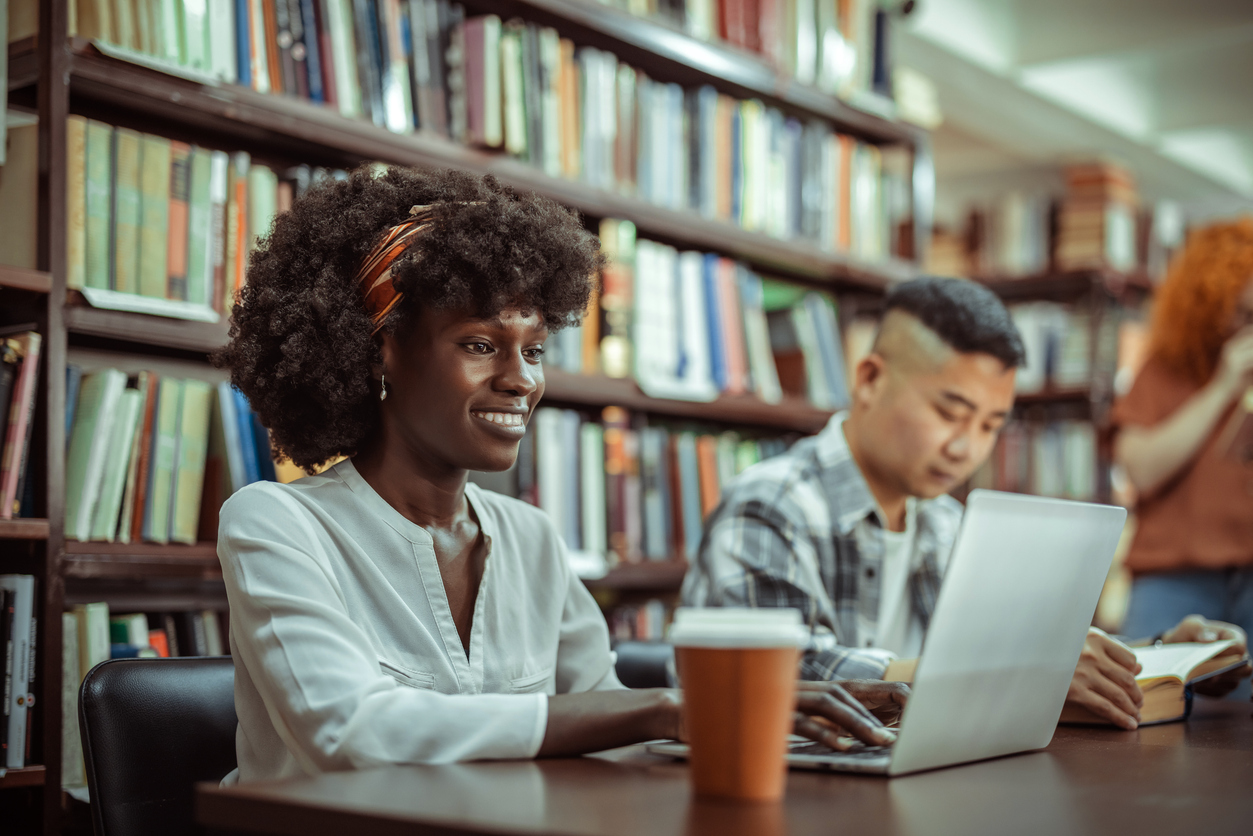 Two People Studying for the Cpa Exam in a Library..jpg